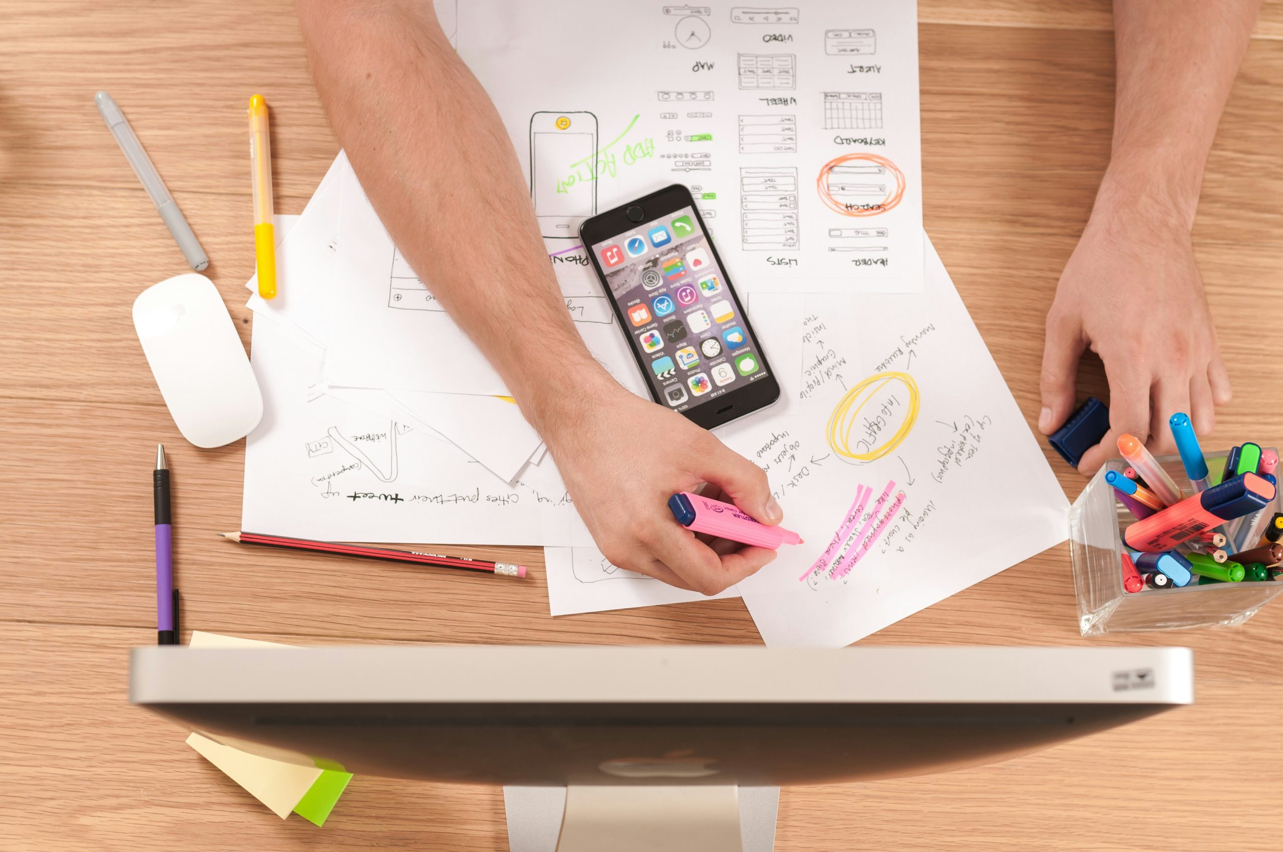 A workspace with tax documents and a smartphone.