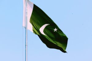 The Pakistan flag waving in the wind.